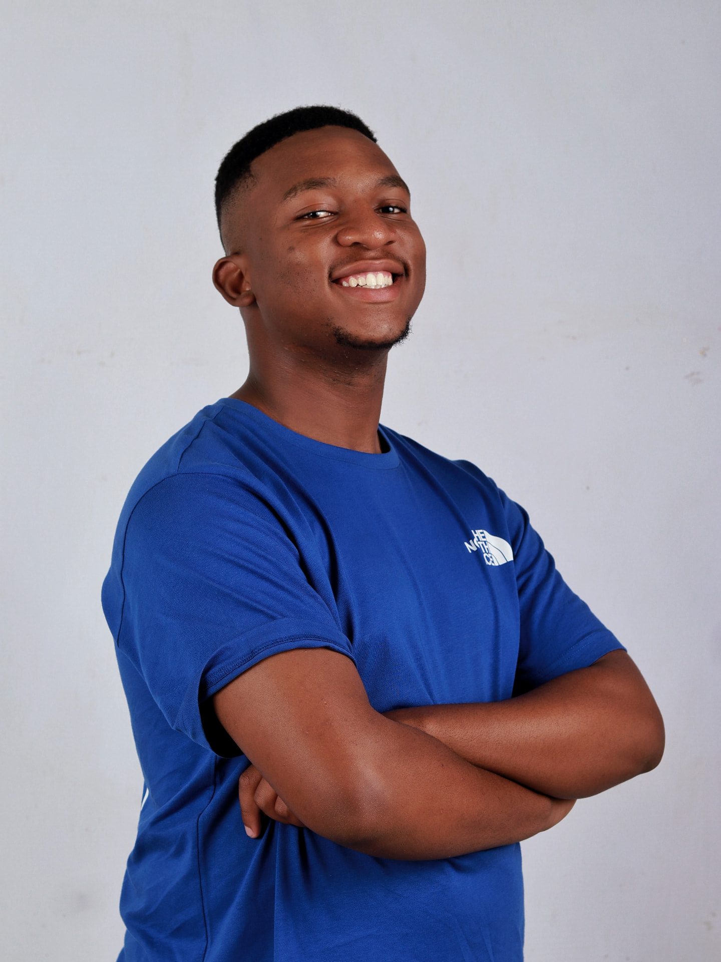 Skhokhie Da DeeJay smiling in studio portrait
